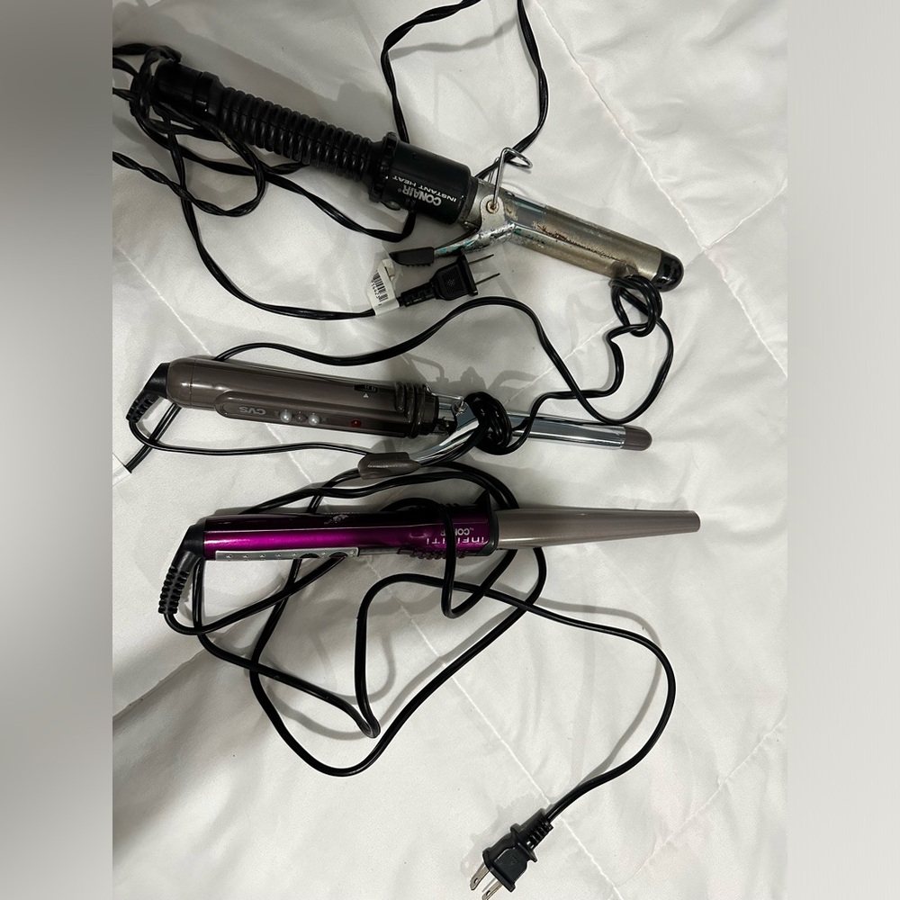 2 curling irons and 1 curling wand